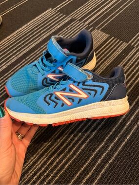New Balance Kids Blue and Red Accent Athletic Sneakers